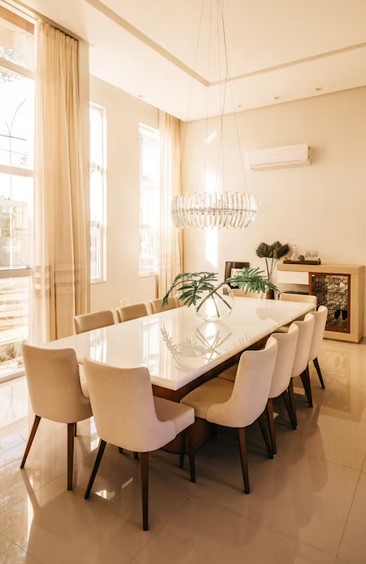 Interior design: formal dining room in white and gold color scheme.