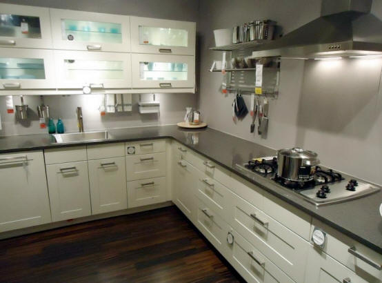 Modern kitchen with white cabinets and dark gray counter top